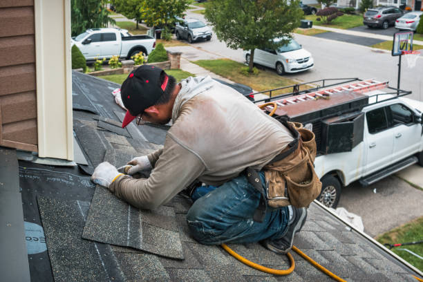 Professional Roofing technician working in Alma, AR